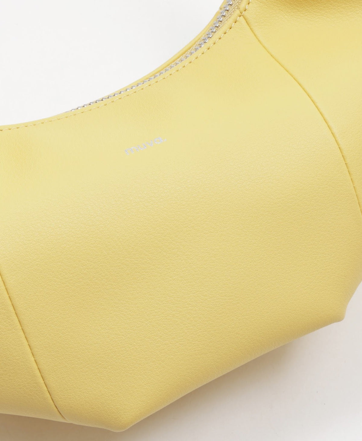 Model carrying the Jingle Mini Croissant Bag in Creamy Yellow