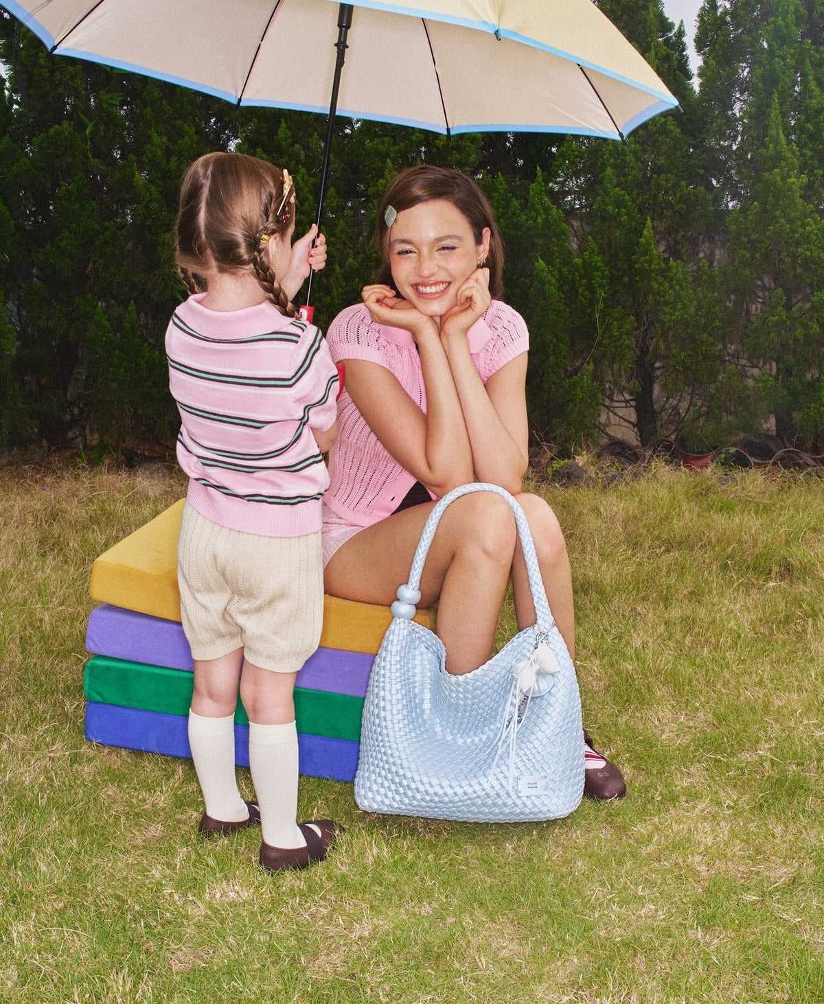 Model carrying the ZhuZhu Woven Shoulder Bag · Pearl in Pearl Blue