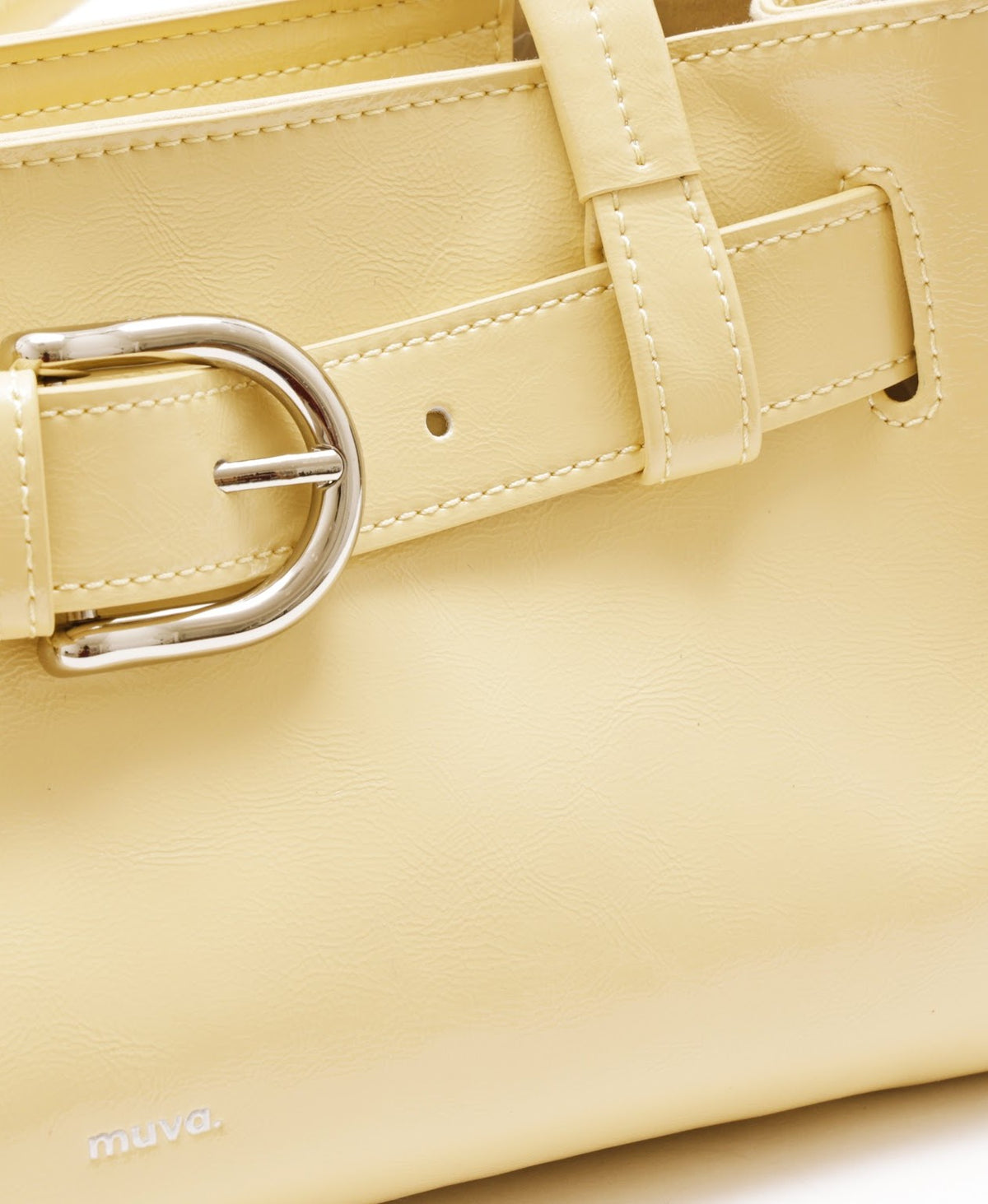 Model carrying the Sweet Cool Buckle Bag in Creamy Yellow