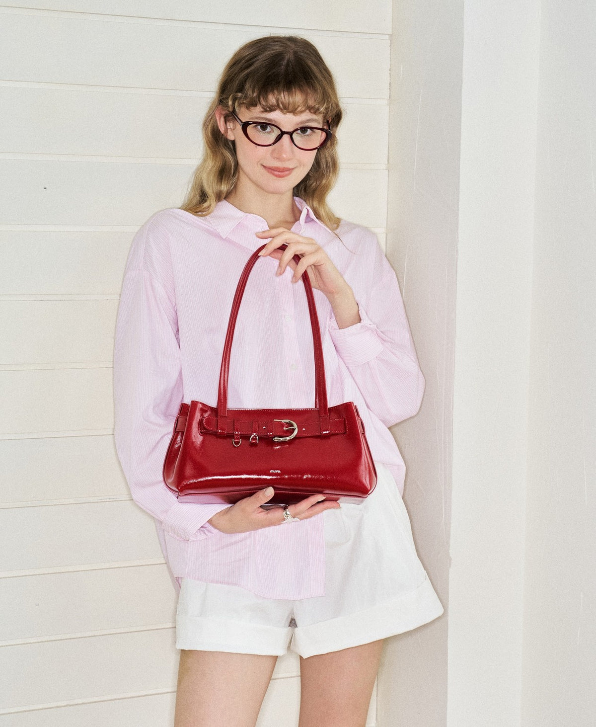 Model carrying the Sweet Cool Buckle Bag in Red