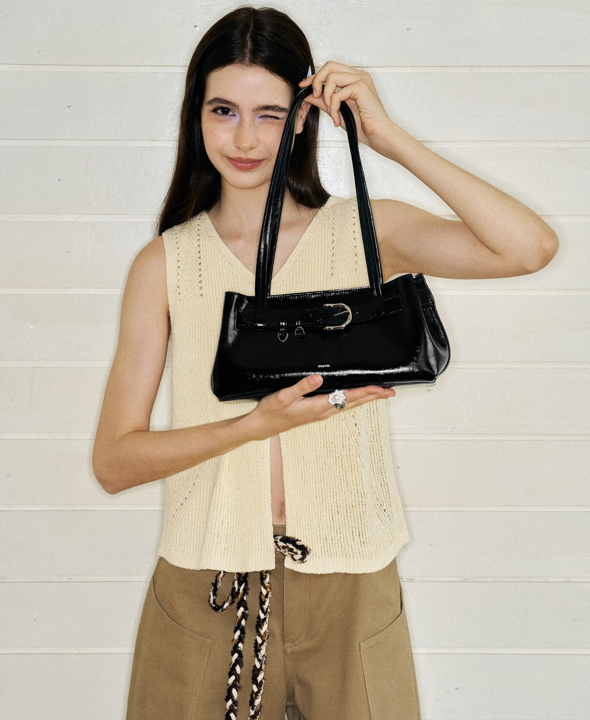 Model carrying the Sweet Cool Buckle Bag in Black