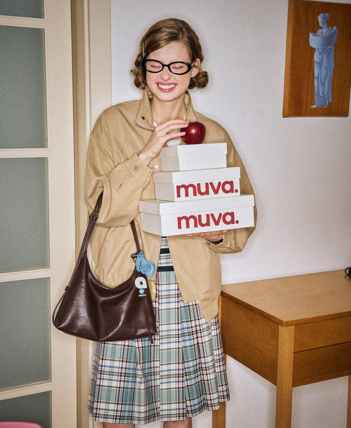 Model carrying the Companion Hobo Bag in Chocolate Brown