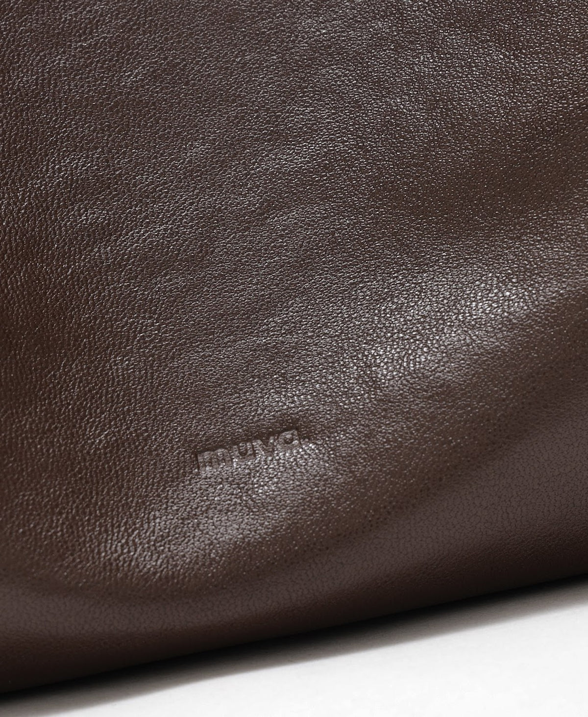 Model carrying the Companion Hobo Bag in Chocolate Brown