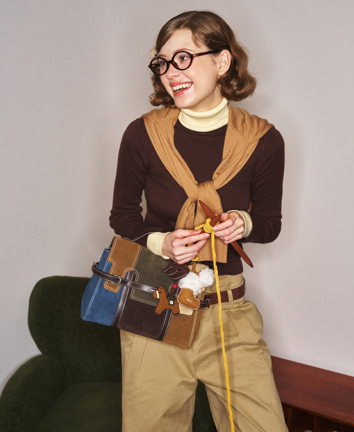 Model carrying the Hopscotch Tales Backpack in Patchwork