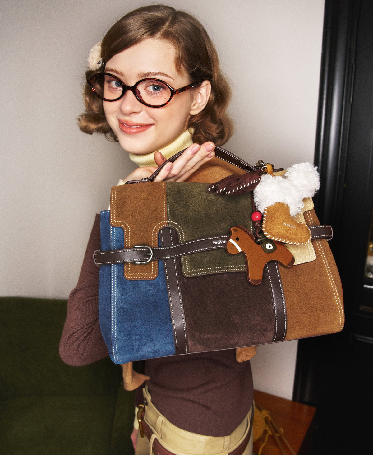 Model carrying the Hopscotch Tales Backpack in Patchwork