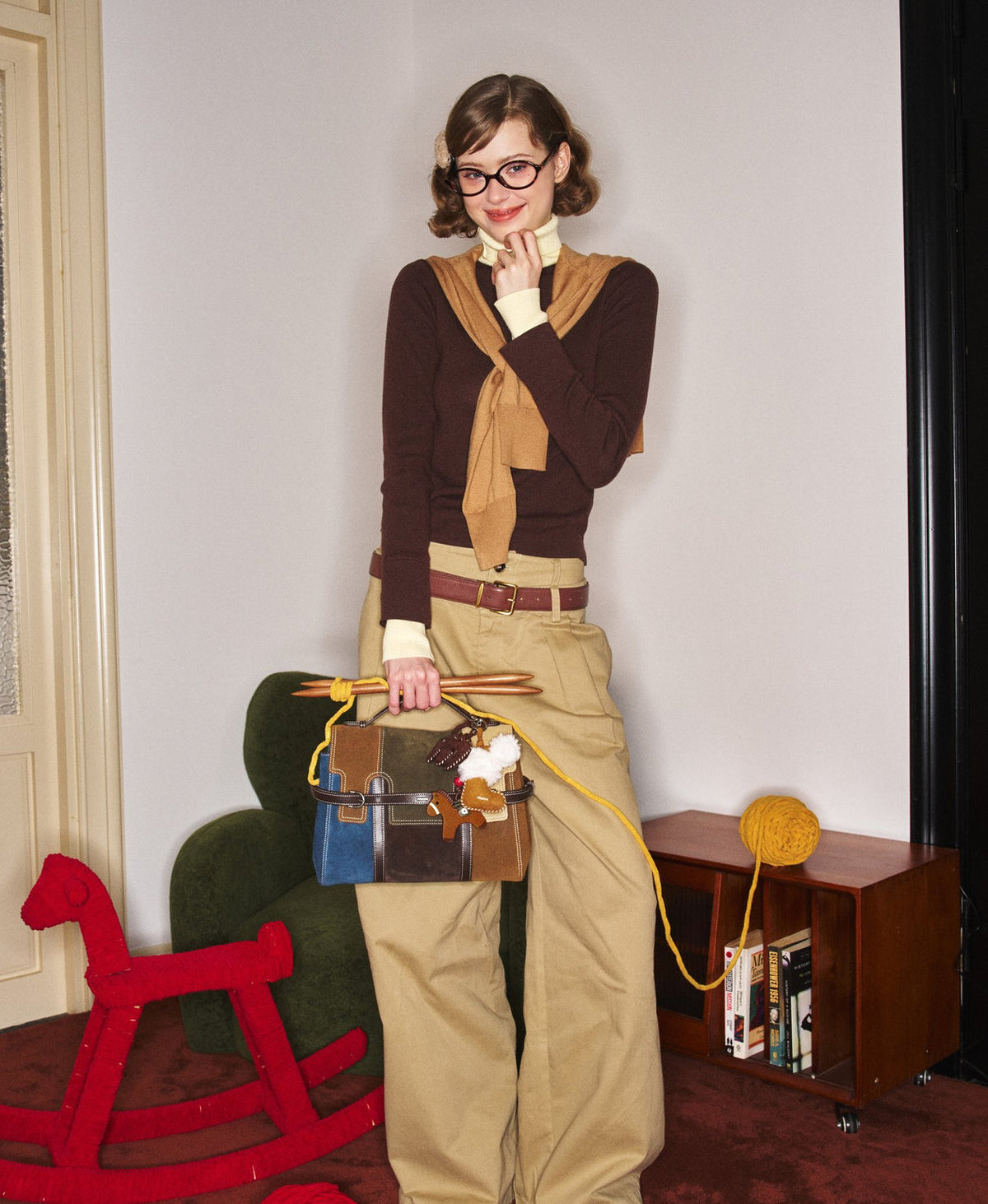 Model carrying the Hopscotch Tales Backpack in Patchwork