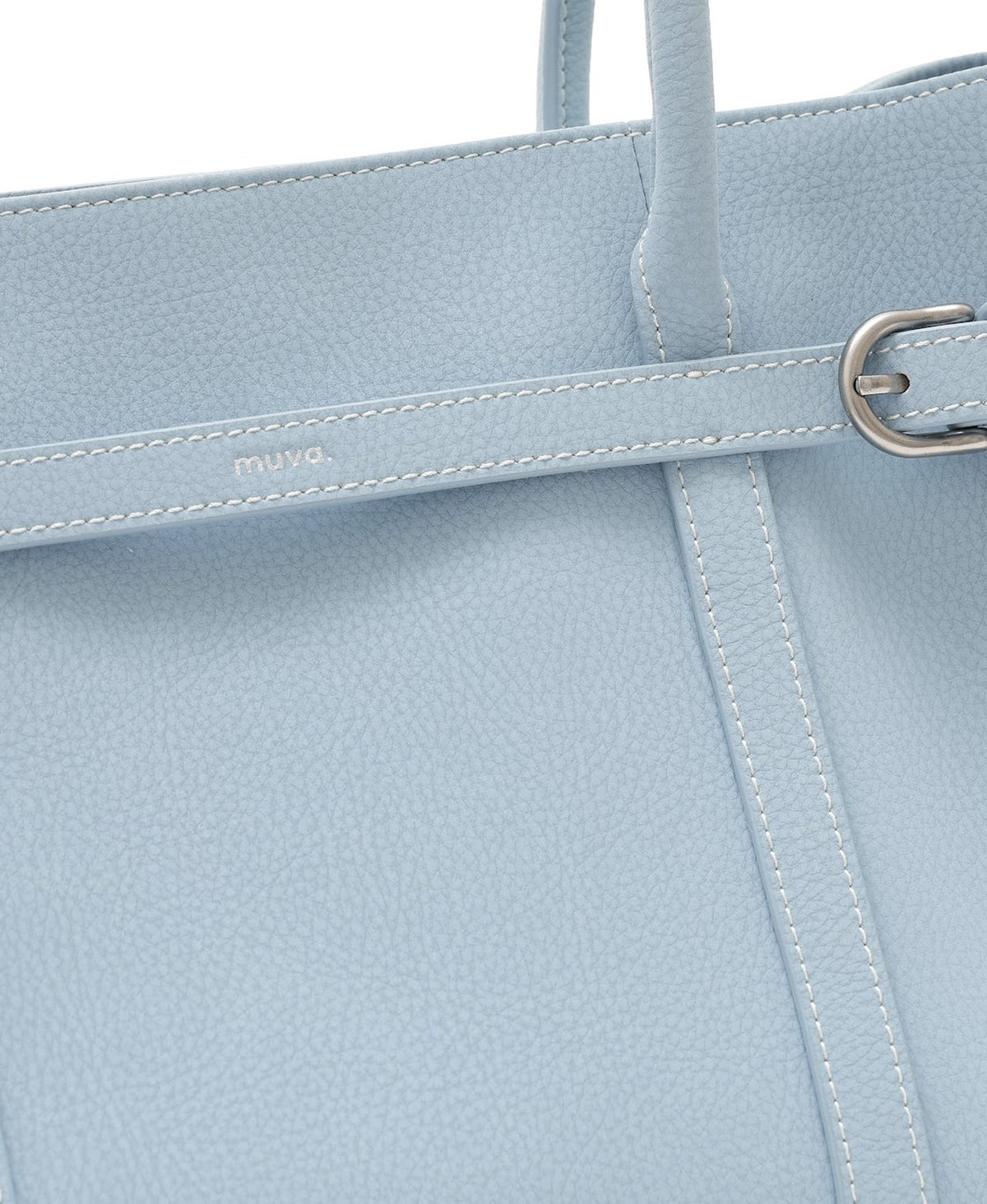 Model carrying the Hopscotch Tales Garden Tote Bag in Sky Blue