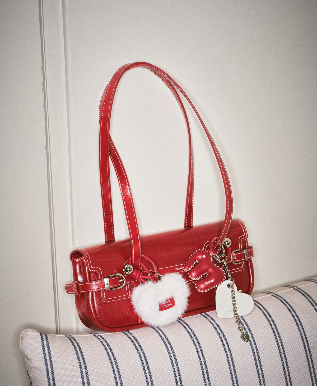 Model carrying the Hopscotch Tales Hopscotch Baguette Bag in Red
