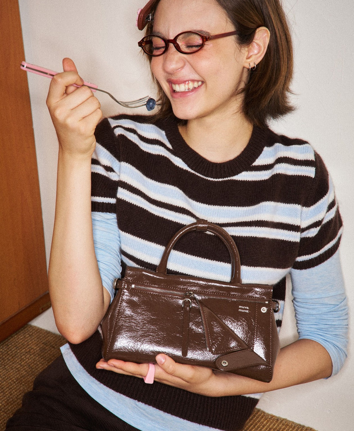 Model carrying the Sweet Cool Free Spirit Flap Bag in Caramel Brown