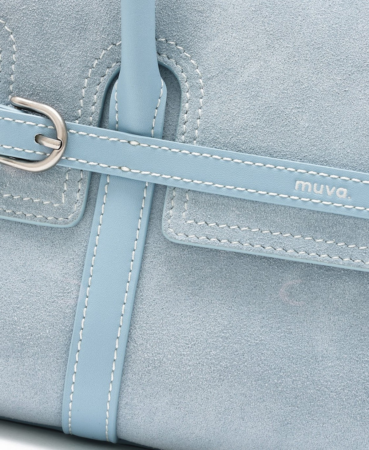Model carrying the Hopscotch Tales Hopscotch Bag · Pastel Suede in Sea Salt Blue