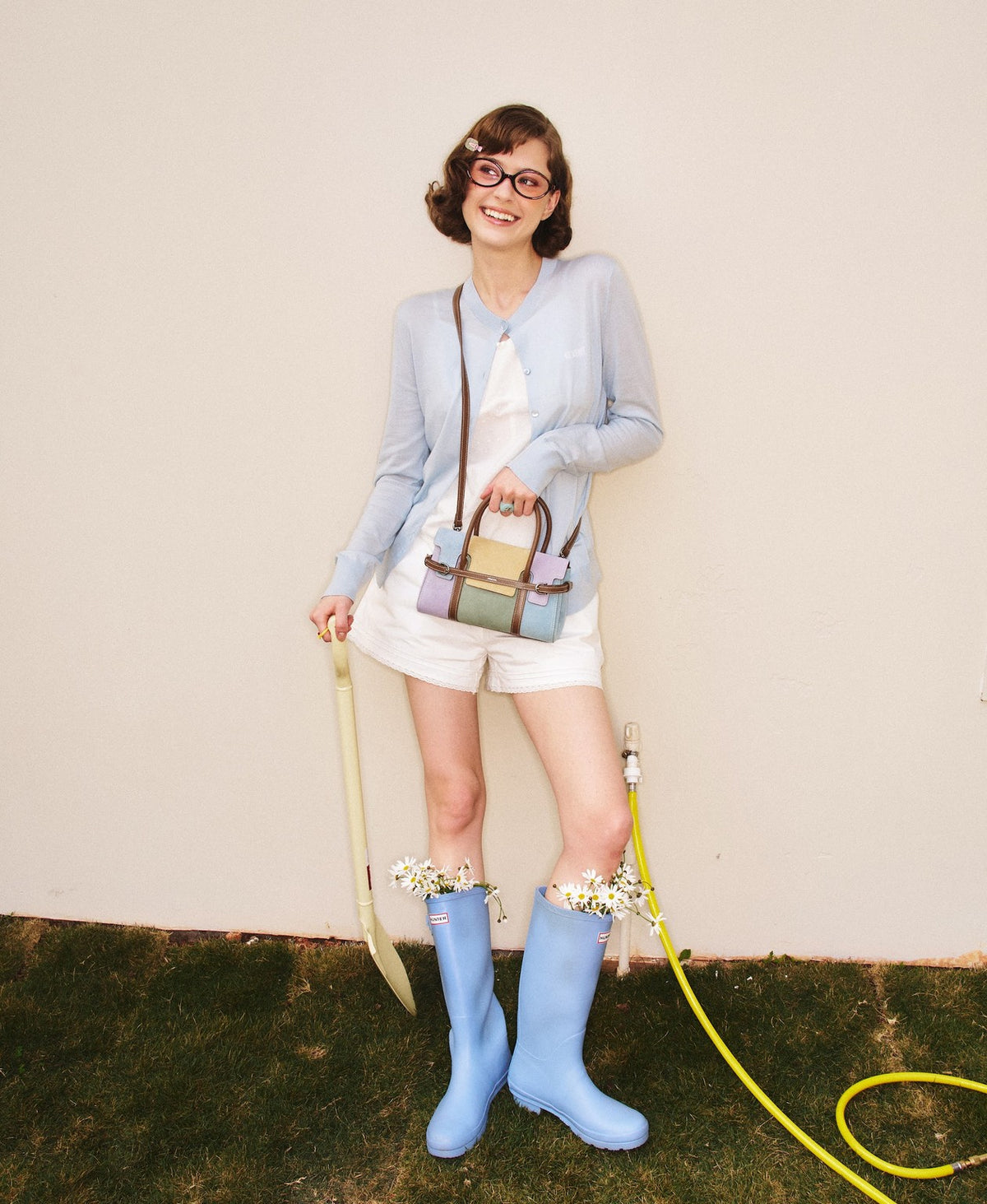 Model carrying the Hopscotch Tales Hopscotch Bag · Patchwork in Taro Canelé