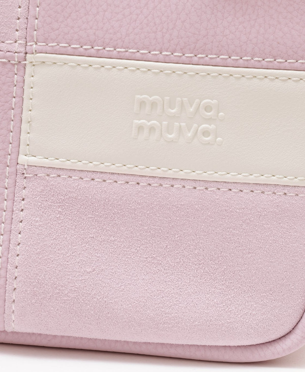 Model carrying the Puzzle Tofu Bag in Soft Pink