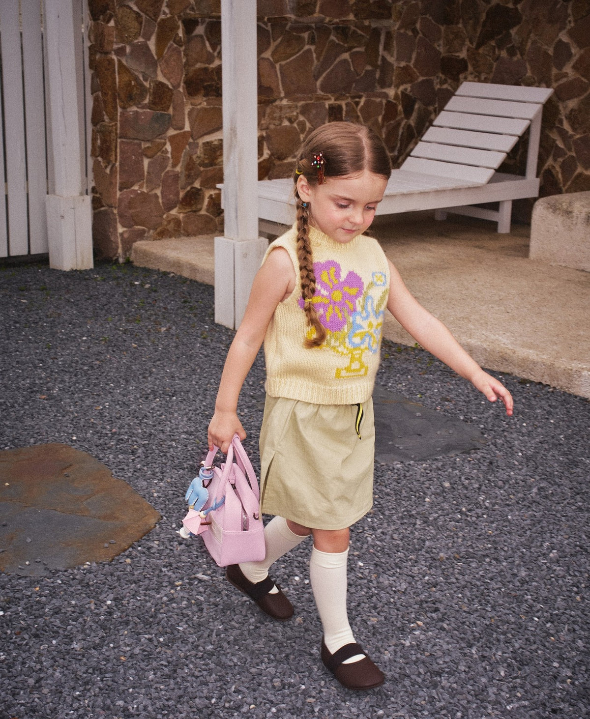 Model carrying the Puzzle Tofu Bag in Soft Pink
