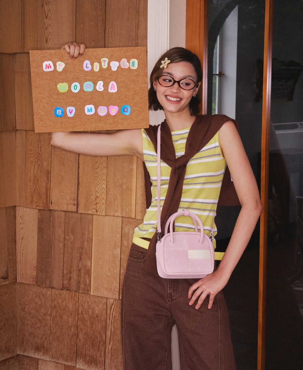 Model carrying the Puzzle Tofu Bag in Soft Pink