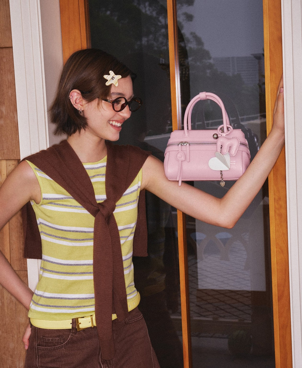Model carrying the Lala Soda Bag in Cherry Blossom Pink