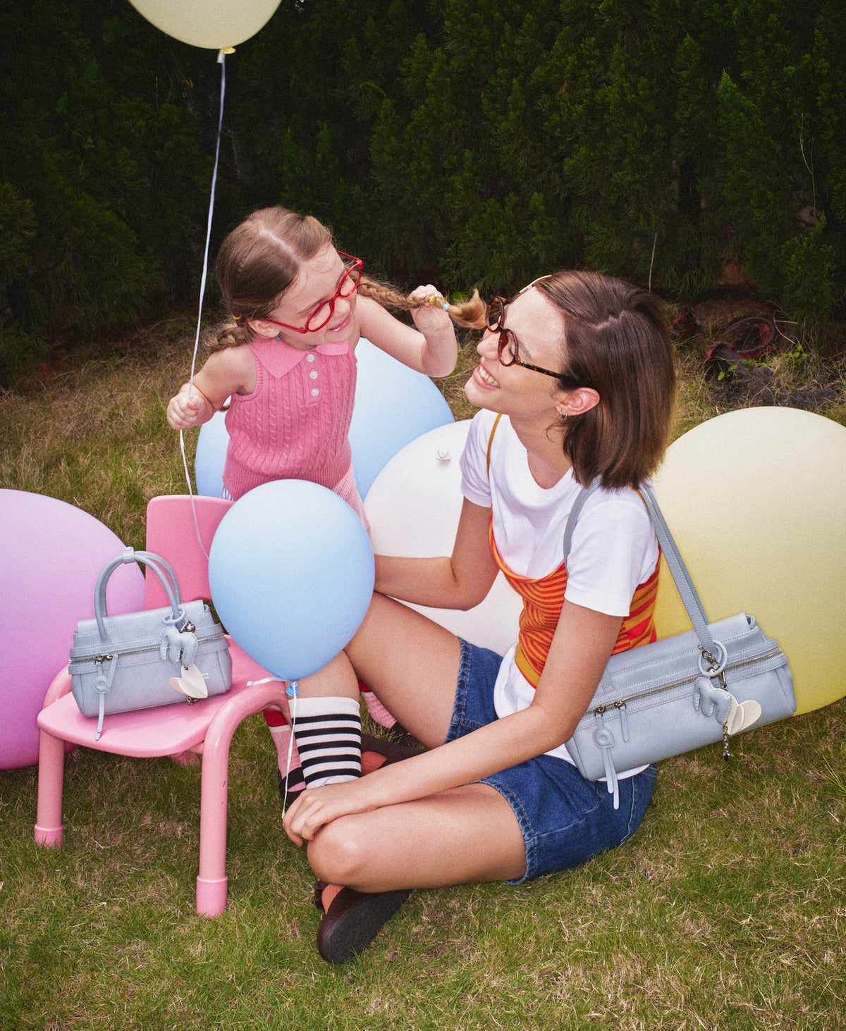 Model carrying the BoBo Lala Soda Bag in Sky Blue