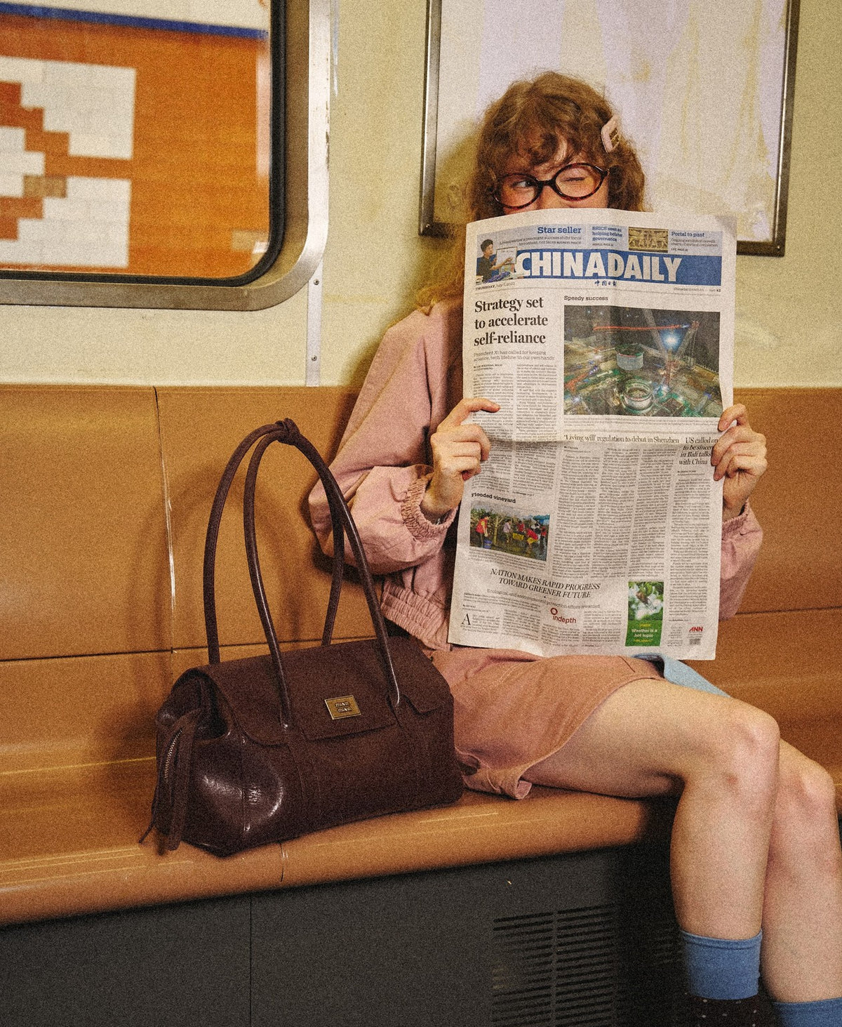 Model carrying the Paradise Treasure Bag in Chocolate Brown
