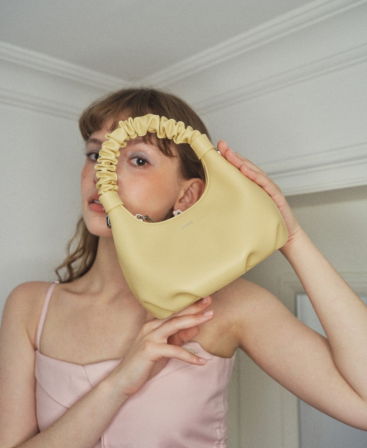 Model carrying the Wonton Bag in Creamy Yellow