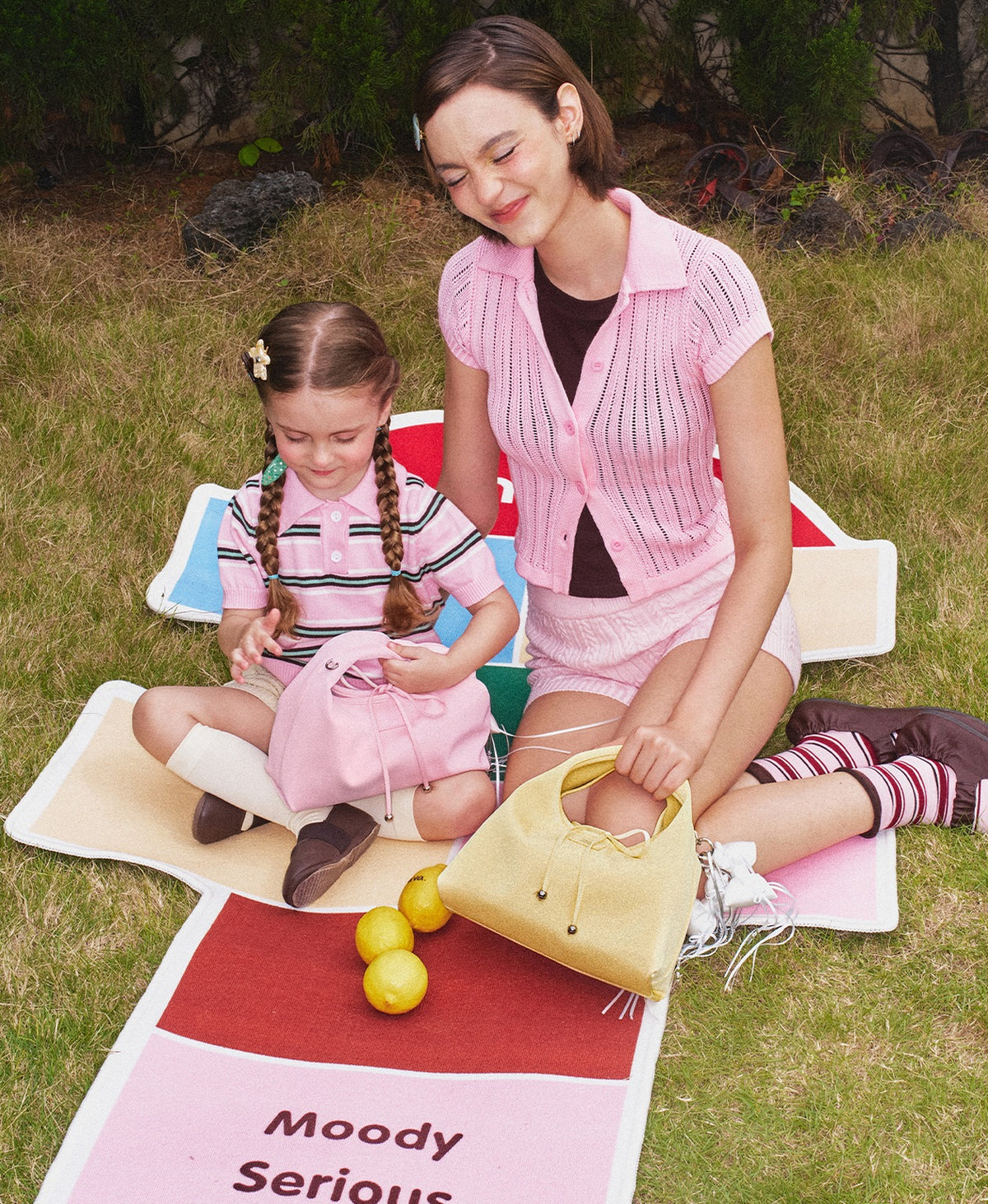 Roly-Poly Triangle Onigiri Bag in Creamy Yellow at a picnic