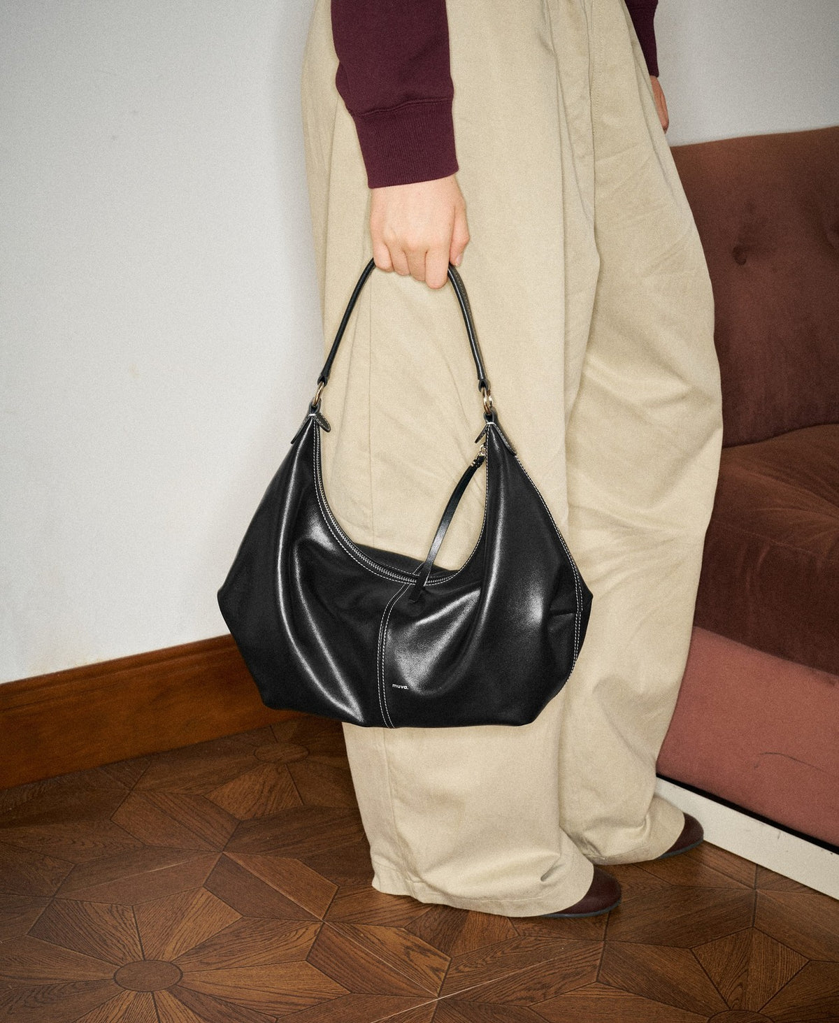 Model carrying the Slouch Hobo Bag in Black