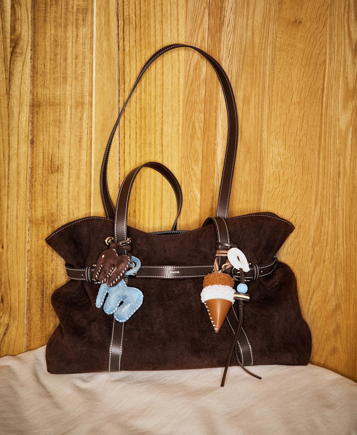 Model carrying the Siu Mai Tote Bag in Chocolate Brown
