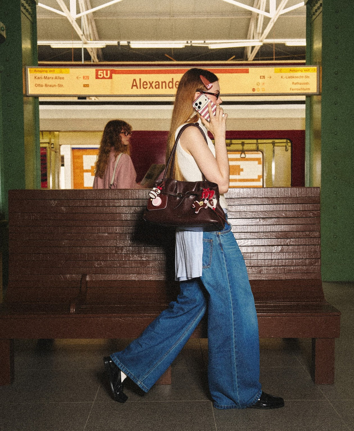 Model carrying the Siu Mai Shoulder Bag in Chocolate Brown
