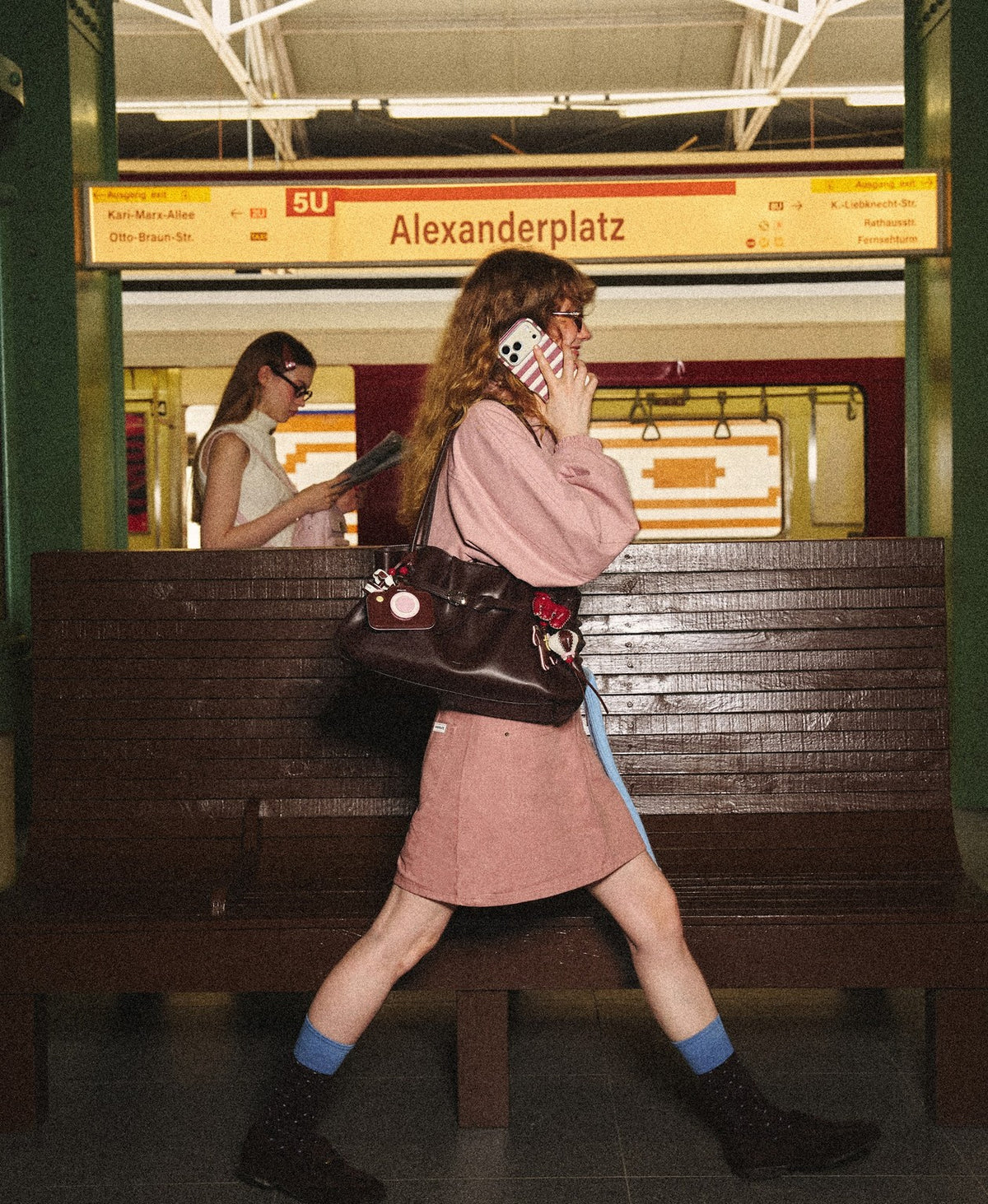 Model carrying the Siu Mai Shoulder Bag in Chocolate Brown